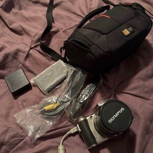 Olympus Silver Digital Camera with Black Case